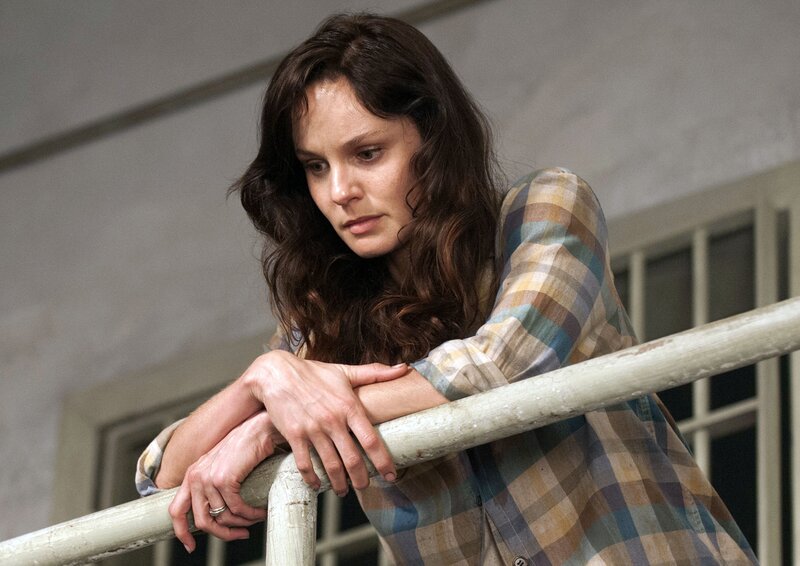 woman leaning on railing