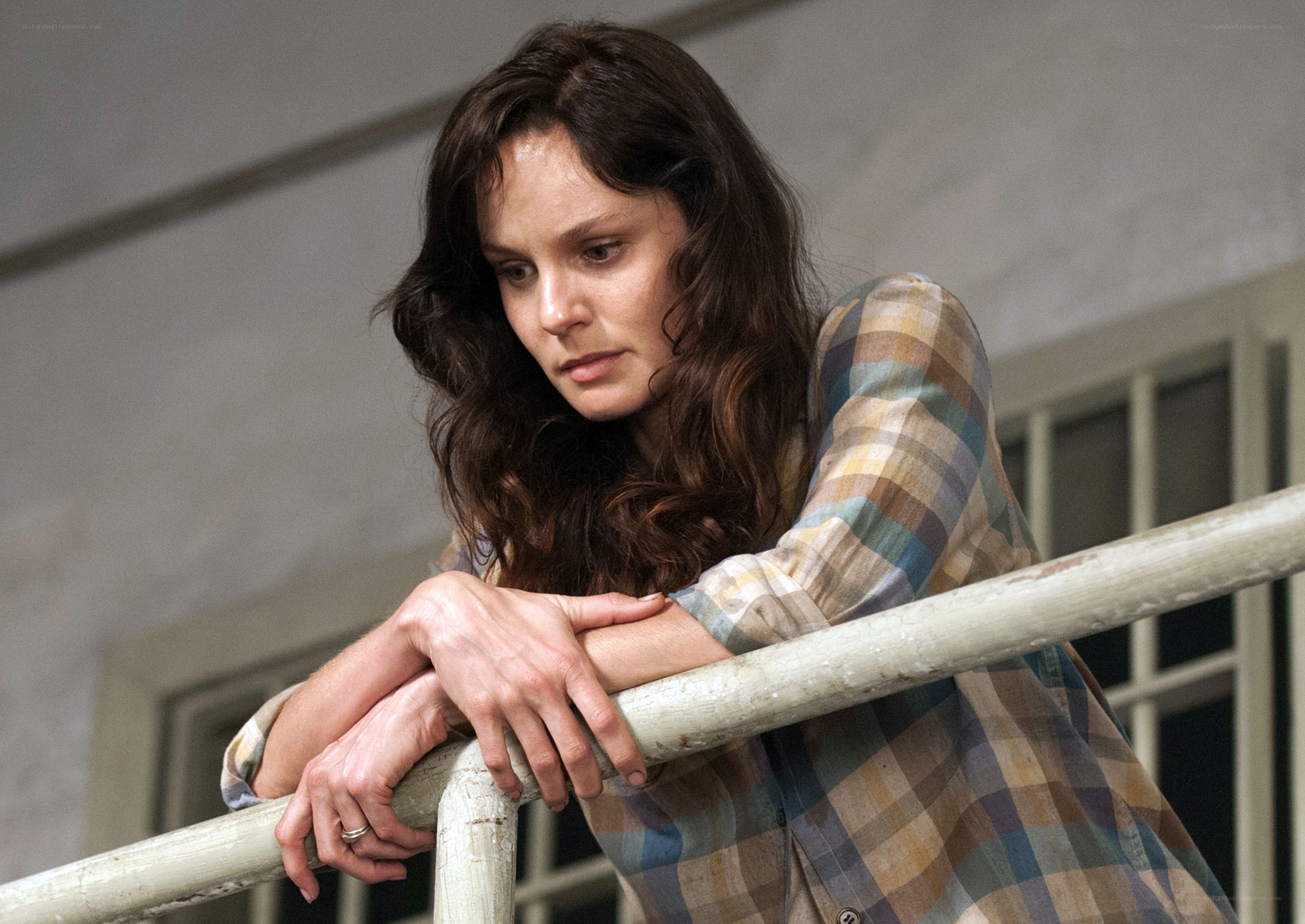 woman leaning on railing