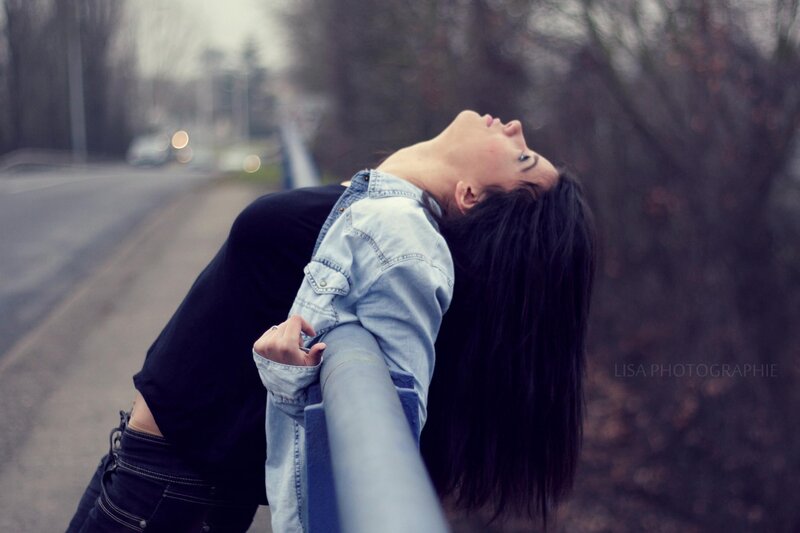 woman leaning on railing