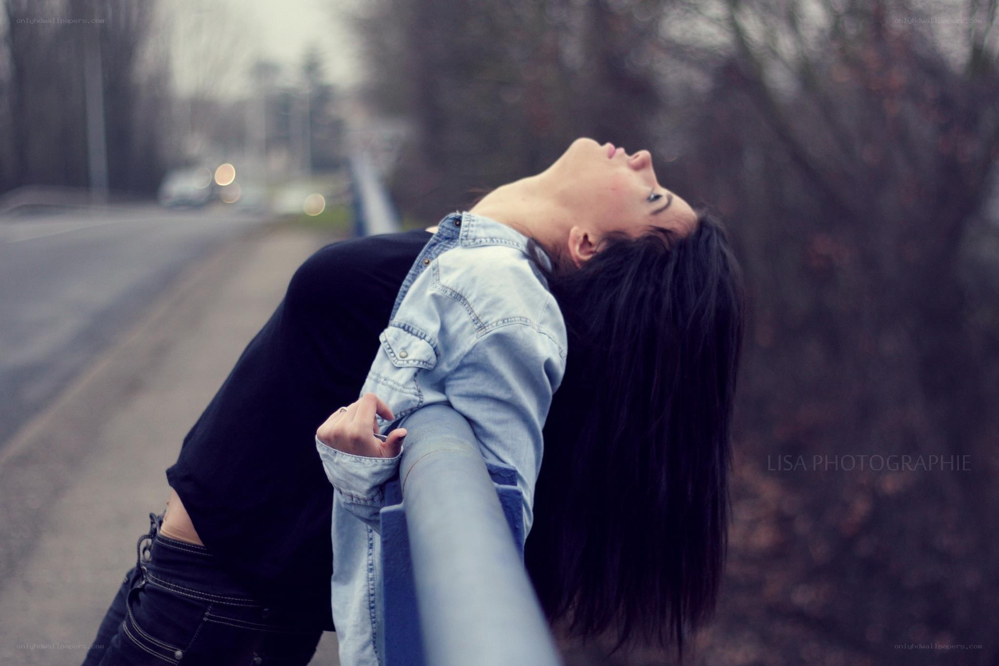 woman leaning on railing