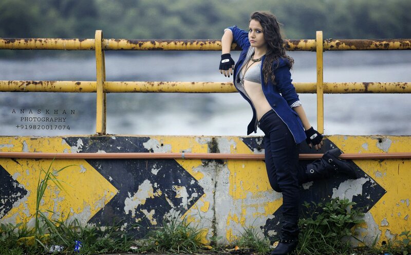 Woman Leaning on Railing — Blue, Dramatic, Photograph