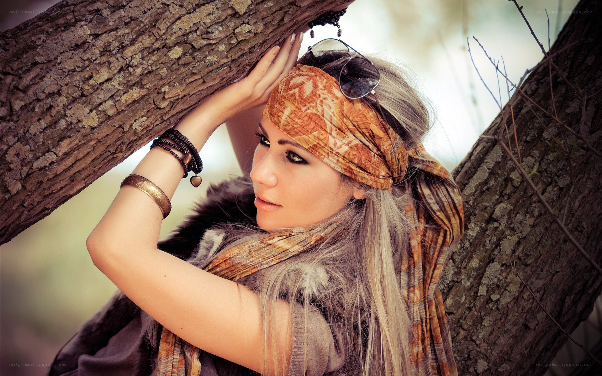 woman leaning on tree