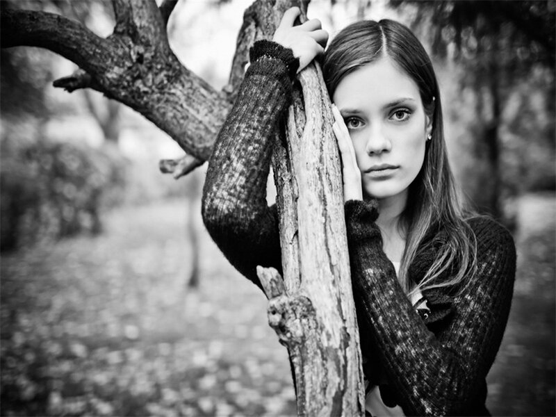 Woman Leaning on Tree — Black, Contemplative, Photograph