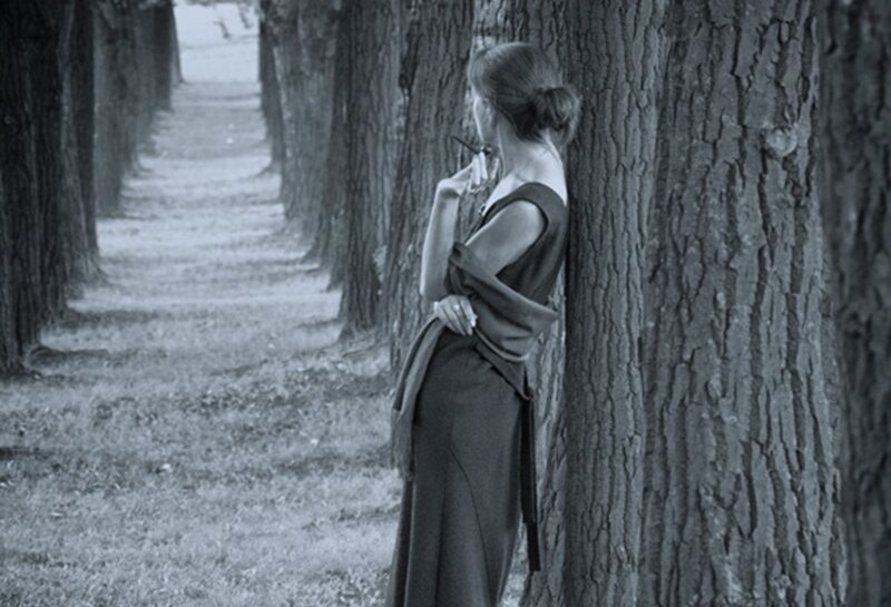 Woman Leaning on Tree — Black, Contemplative