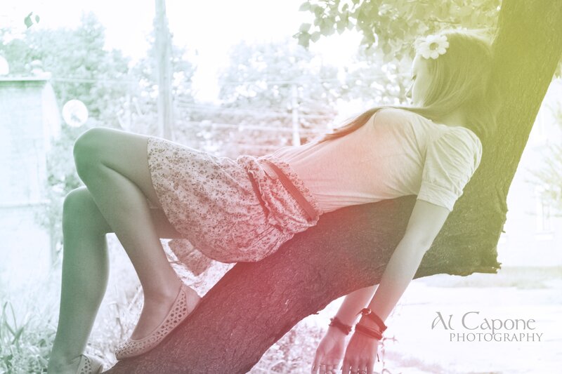 Woman Leaning on Tree — Green, Serene, Afternoon, Photograph, Flower