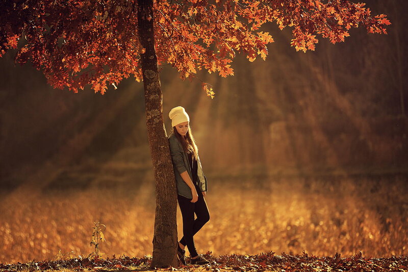 Woman Leaning on Tree — Orange