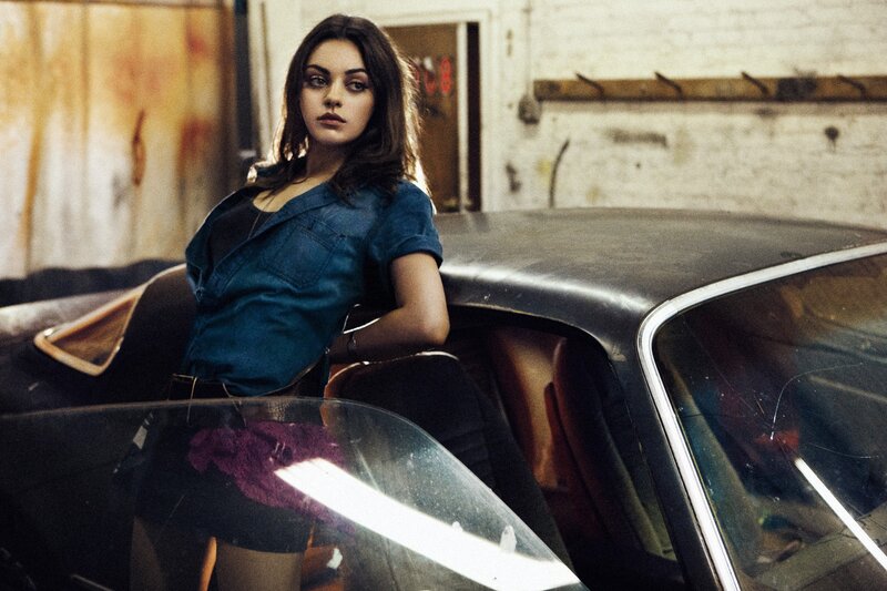 woman leaning on vintage car