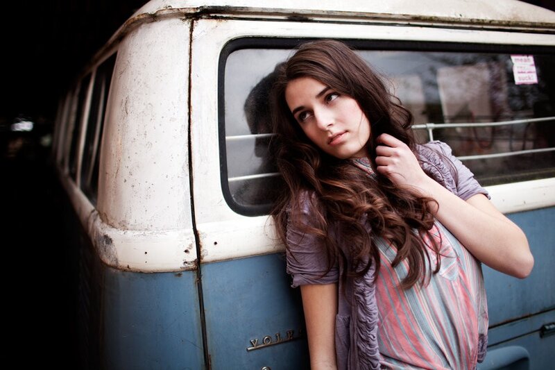 woman leaning on vintage van