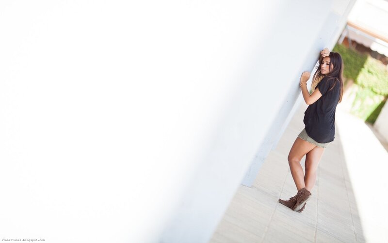 woman leaning on wall