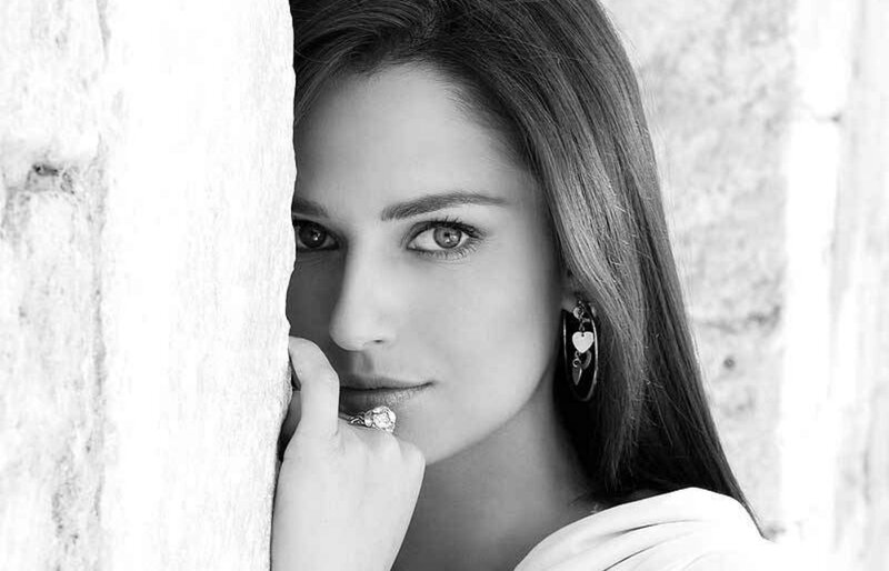 Woman Leaning on Wall — Black, Dramatic, Photograph