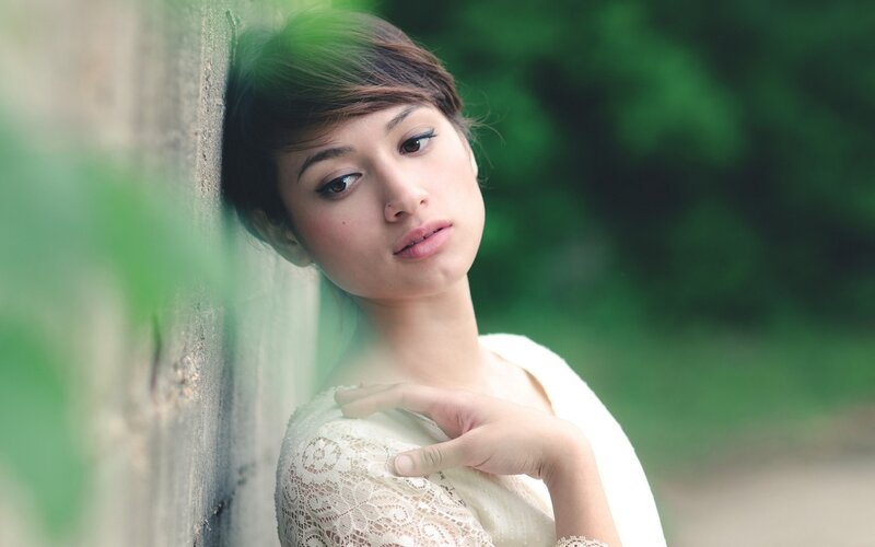 Woman Leaning on Wall — White