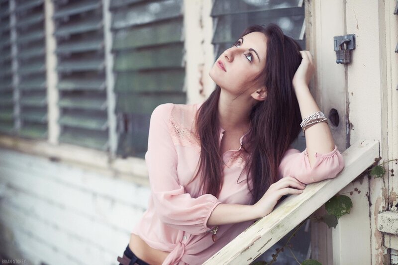 woman leaning on window frame