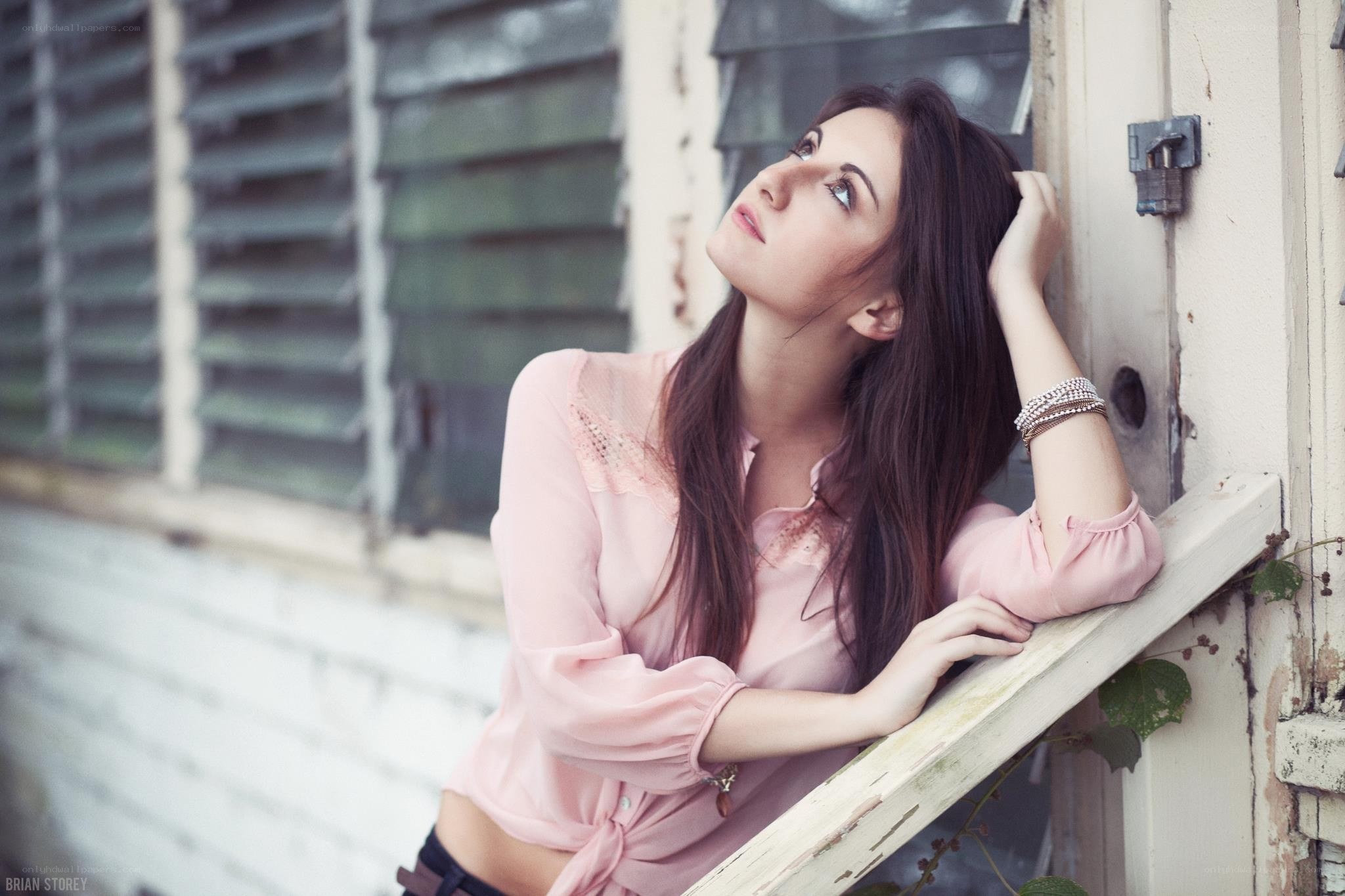 woman leaning on window frame
