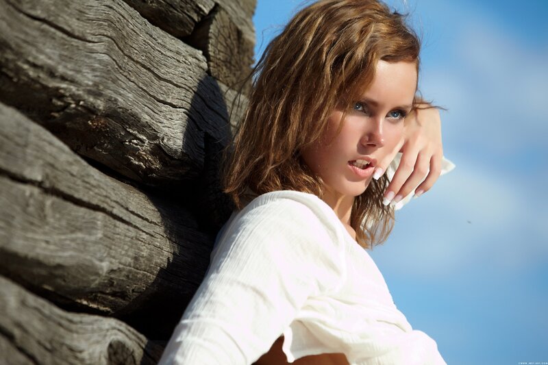 Woman Leaning on Wood