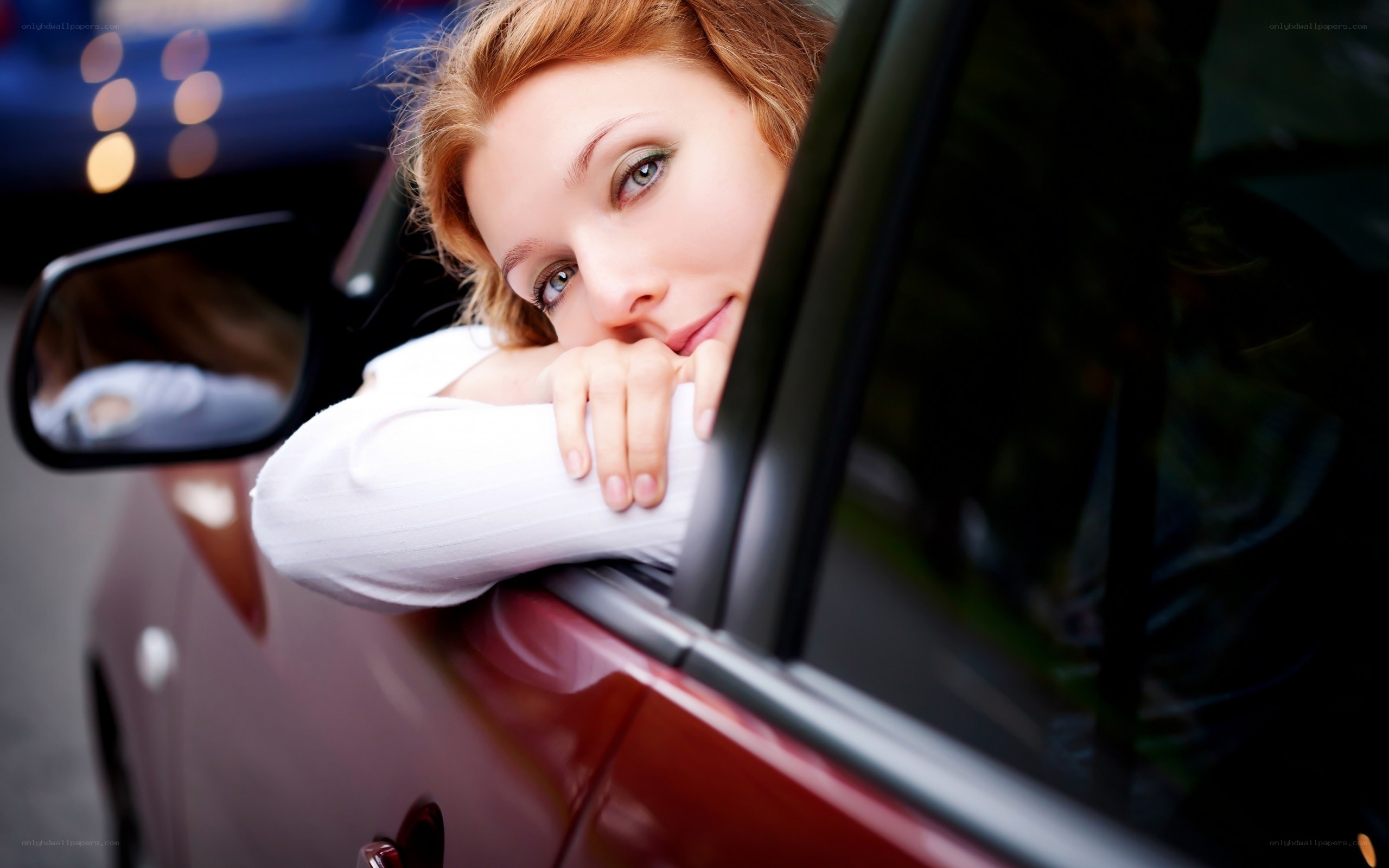 woman leaning out of car window