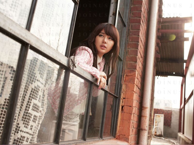 woman leaning out of window
