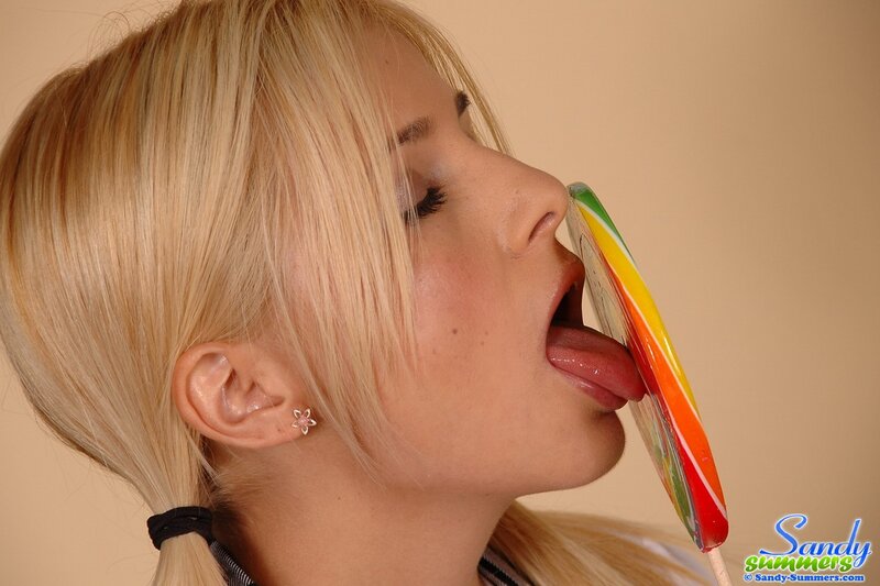 woman licking a lollipop