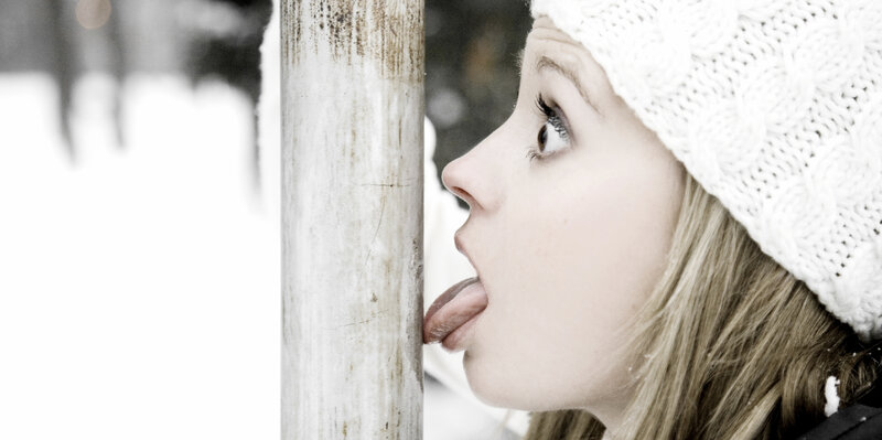 Woman Licking a Pole