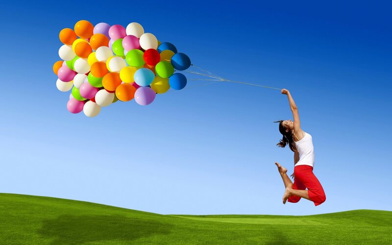 woman lifted by balloons