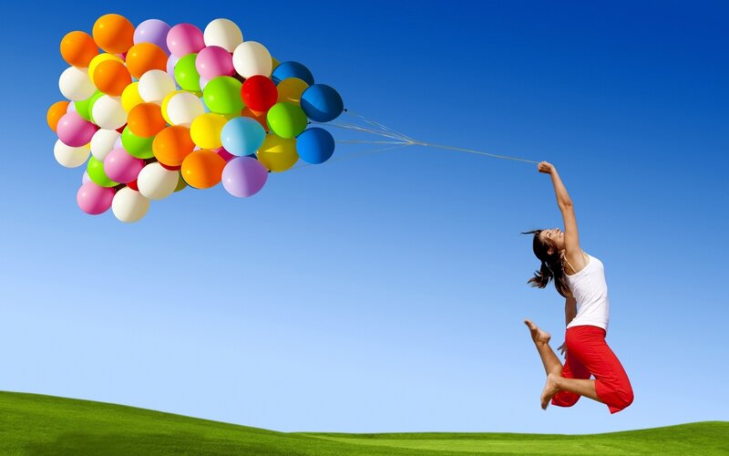 woman lifted by balloons