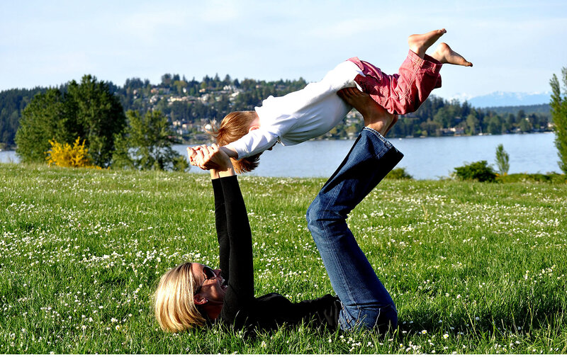 Woman Lifting Child