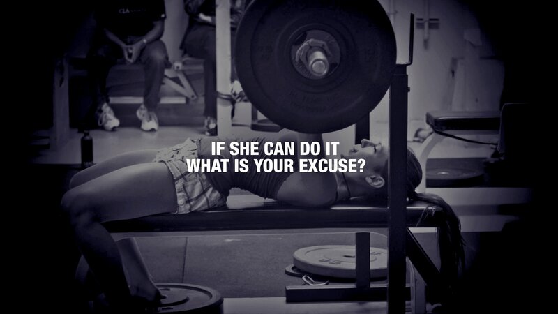 woman lifting weights in gym