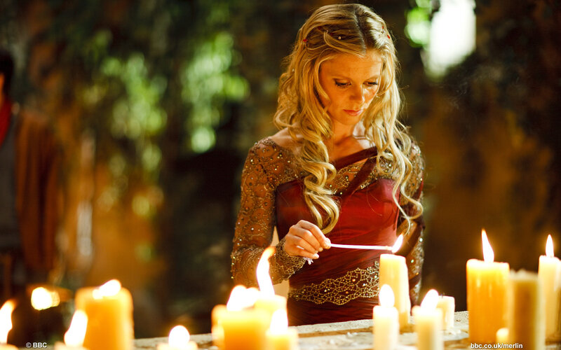 Woman Lighting Candles