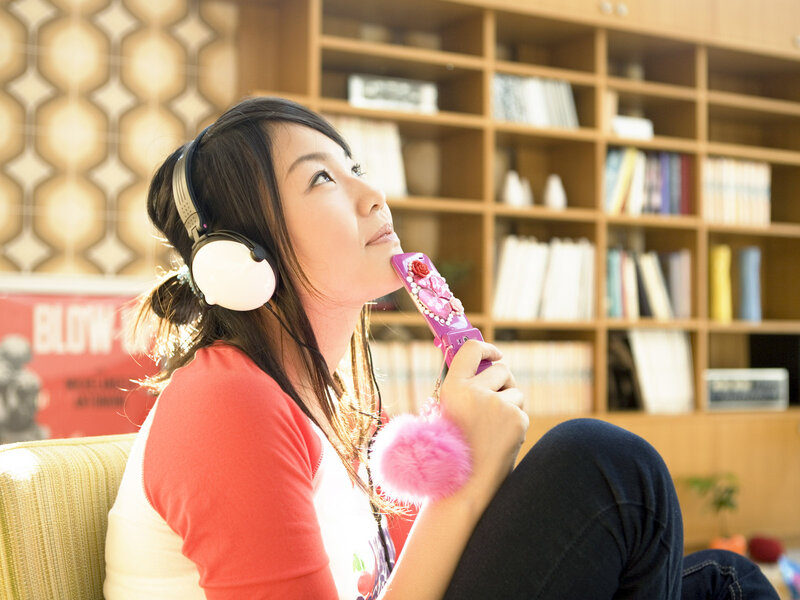 woman listening to music at home