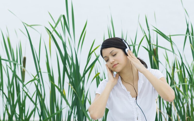 Woman Listening to Music — Green, Calm