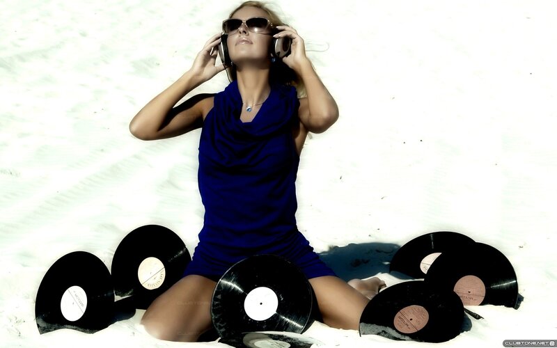 woman listening to music on beach