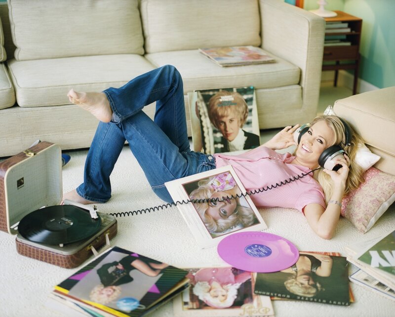 woman listening to music on floor
