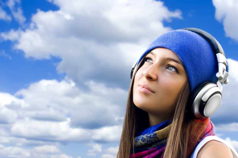 woman listening to music outdoors
