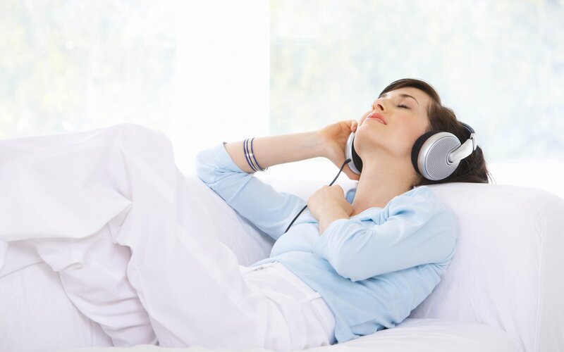Woman Listening to Music — White, Relaxed