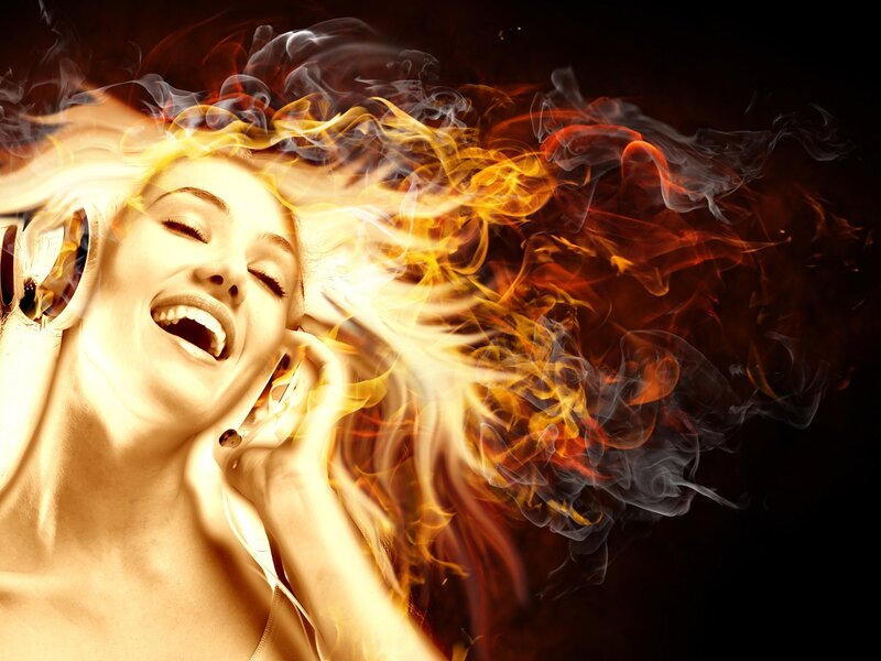 woman listening to music with flames
