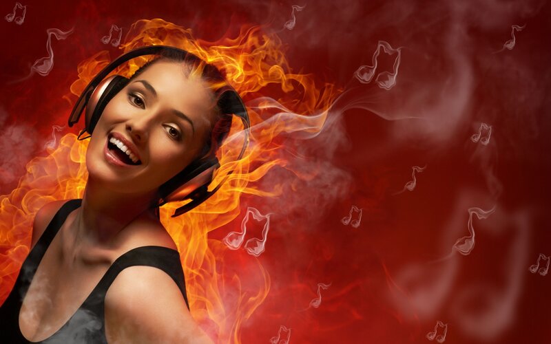 woman listening to music with flames