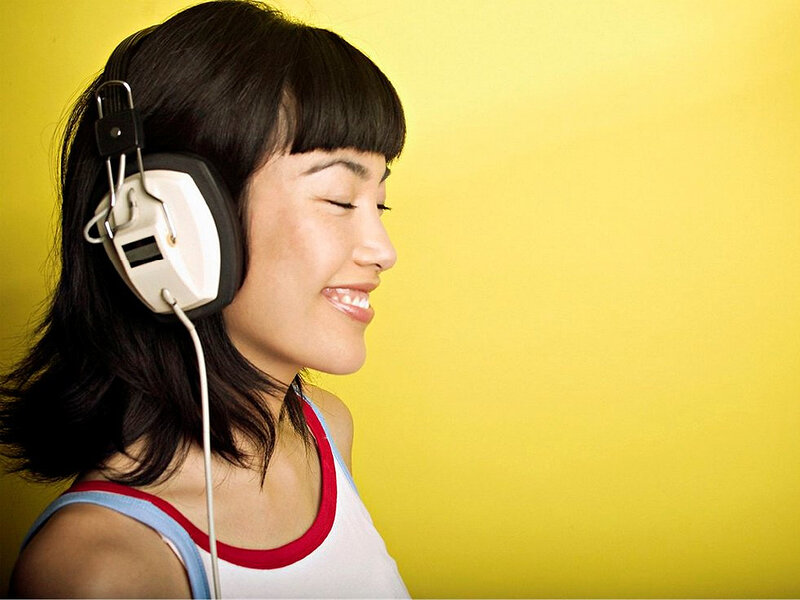 woman listening to music with headphones