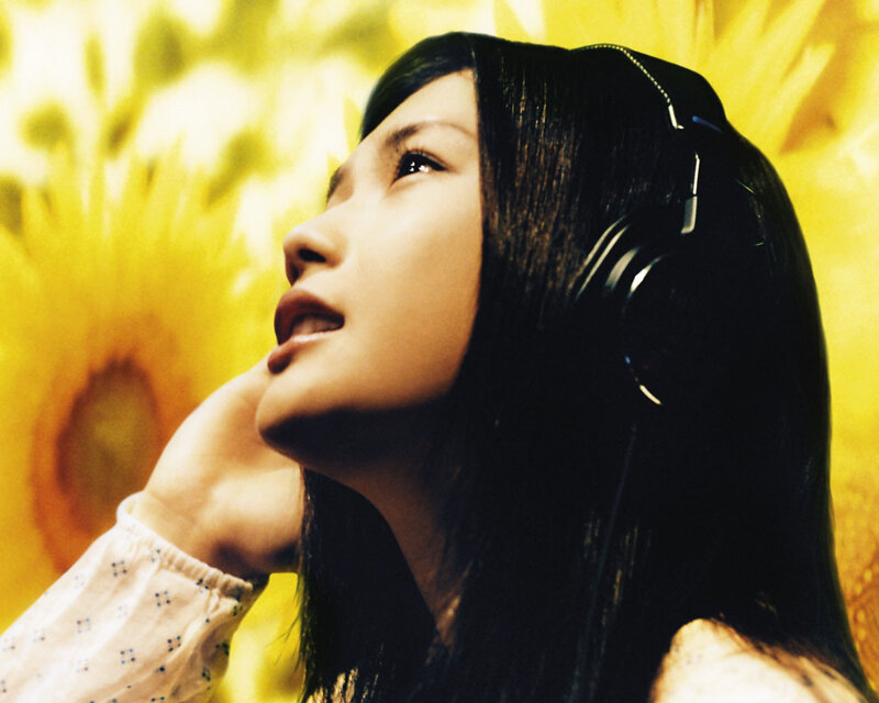 woman listening to music with headphones