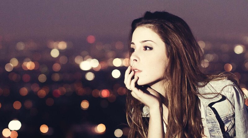 woman looking at city lights