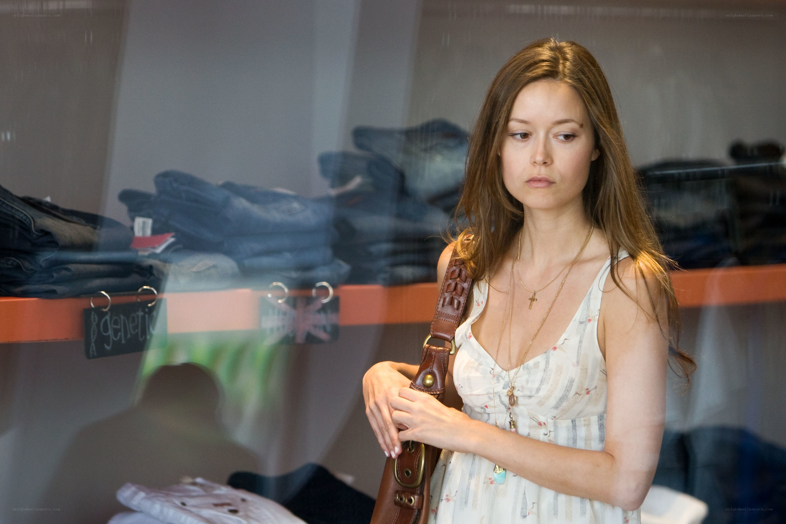 woman looking at clothes in store