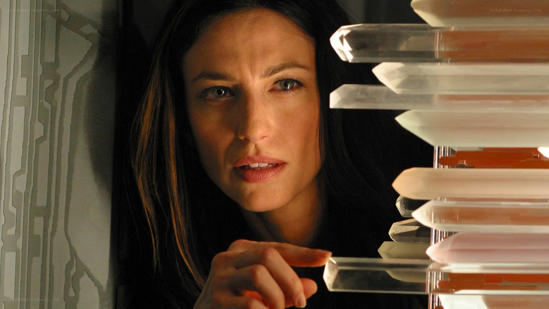 woman looking at crystals