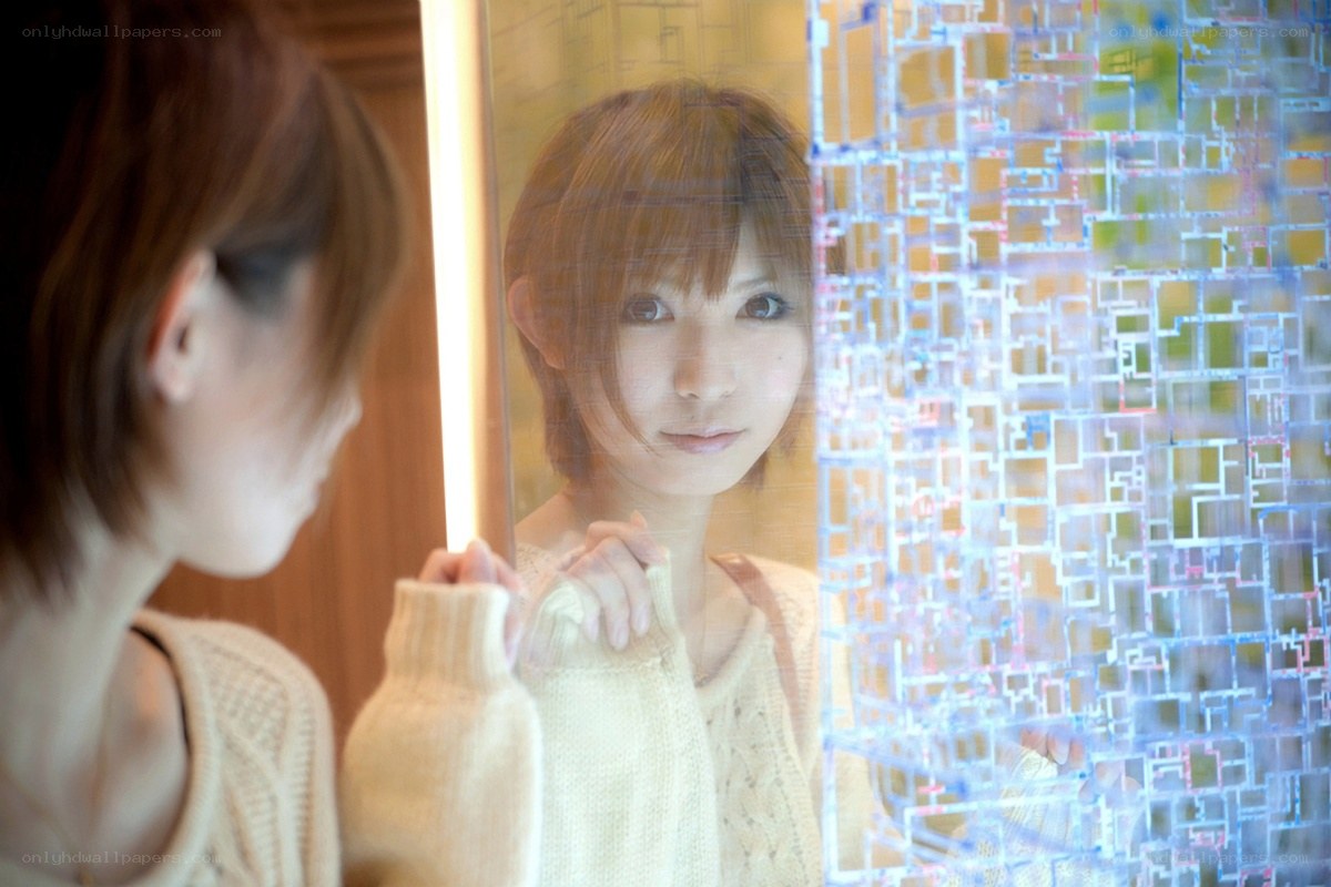 woman looking at her reflection