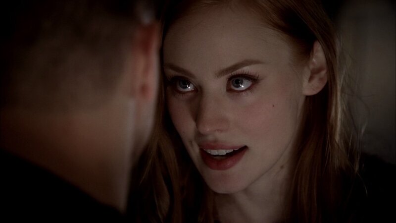 woman looking at man in dim light