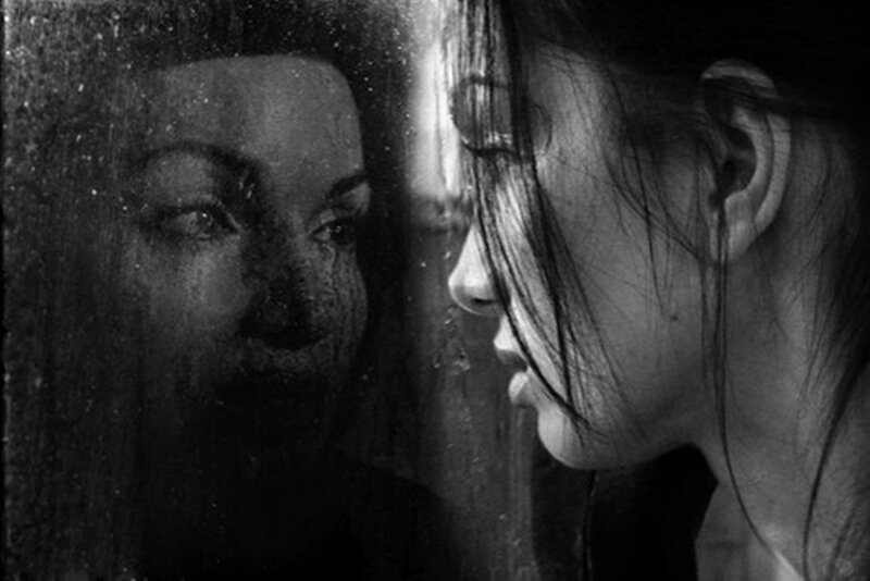 Woman Looking at Reflection — Black, Dramatic