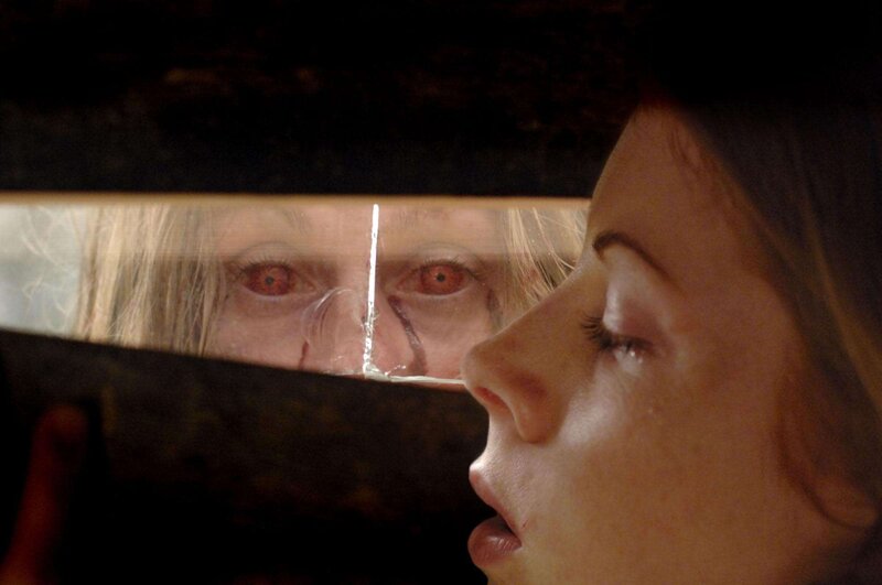 Woman Looking at Reflection — Brown, Dramatic, Photograph