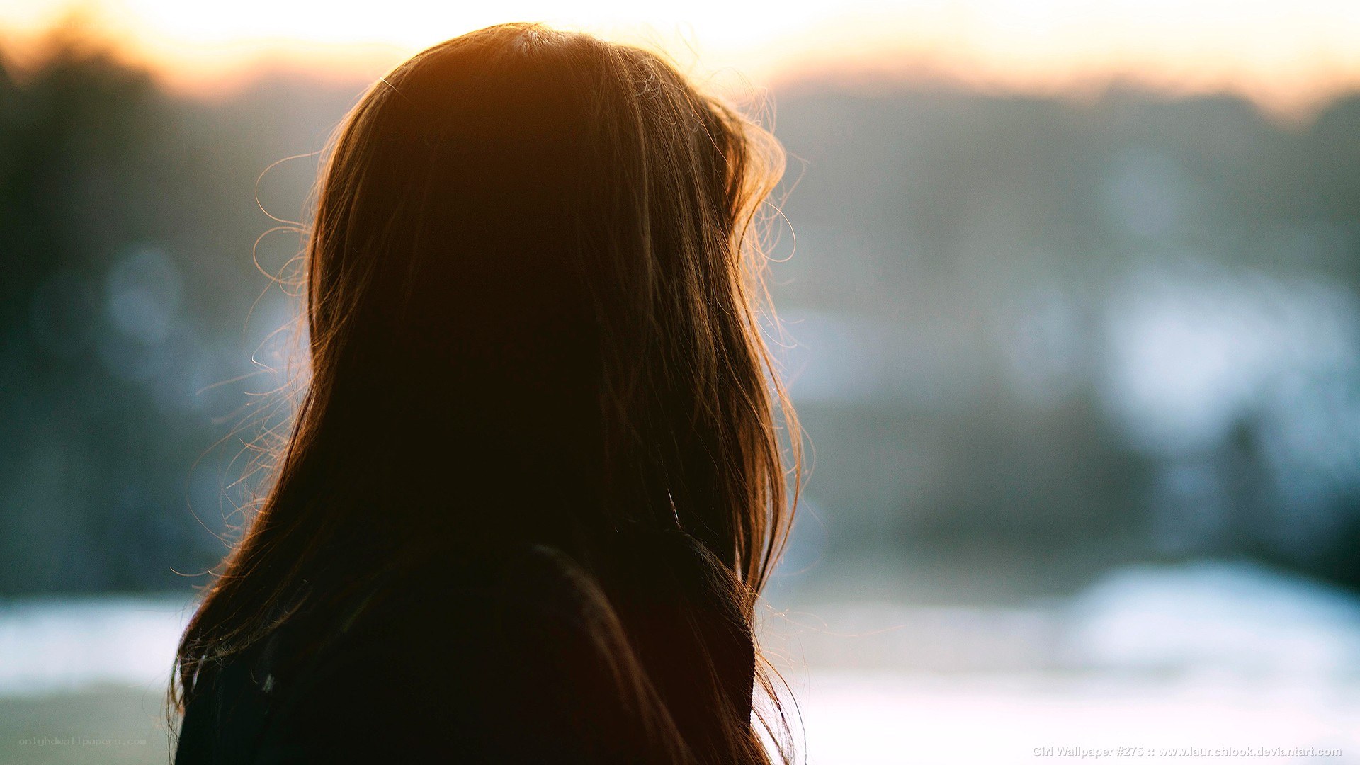 woman looking at sunset