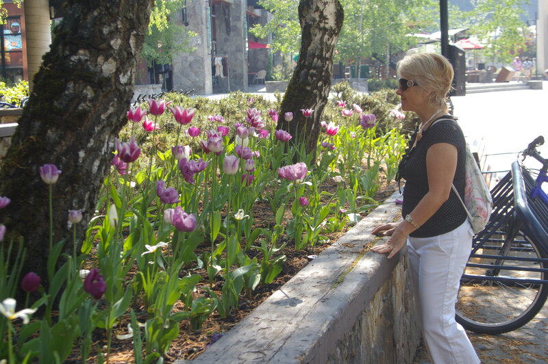 Woman Looking at Tulips