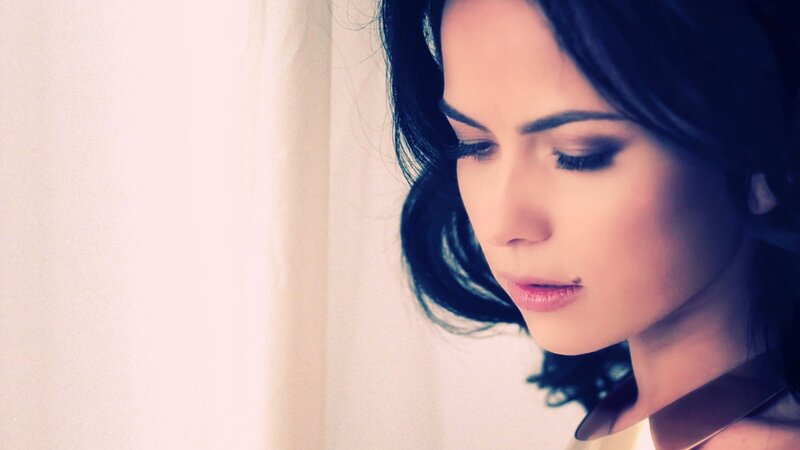 woman looking down thoughtfully