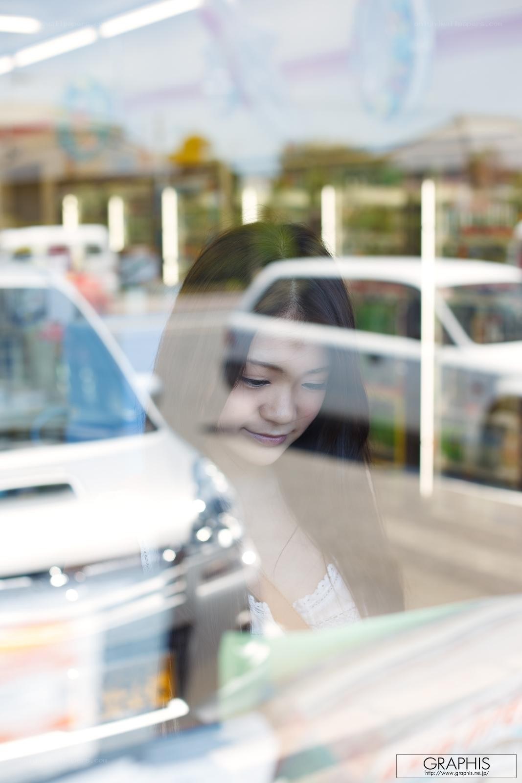 woman looking down through glass