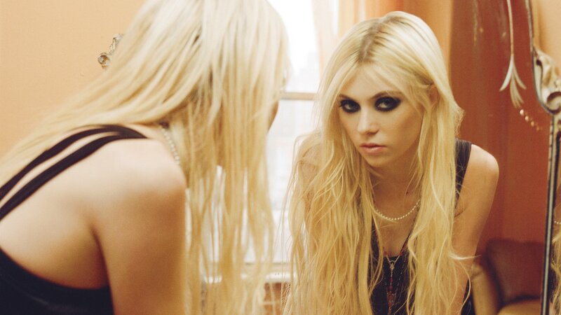 woman looking in mirror
