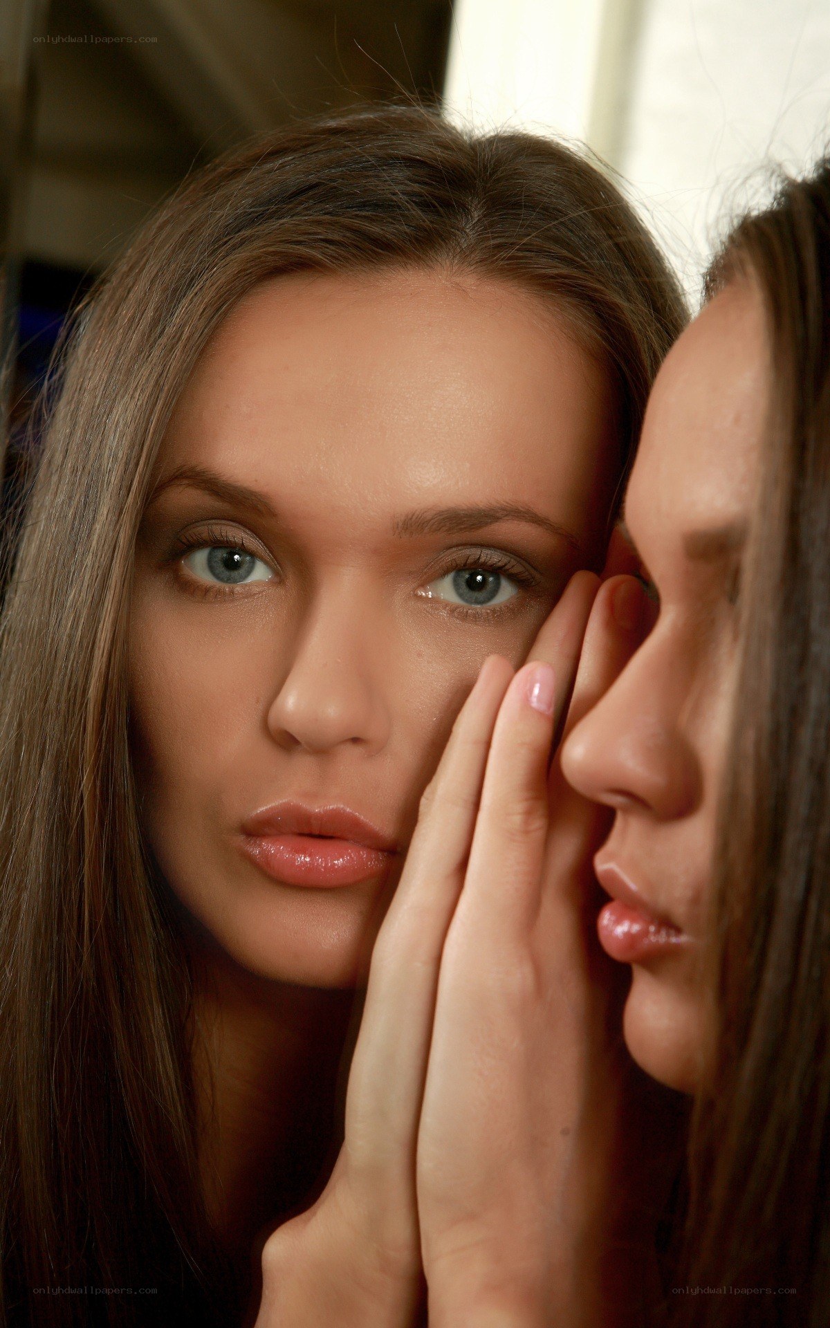 woman looking in mirror
